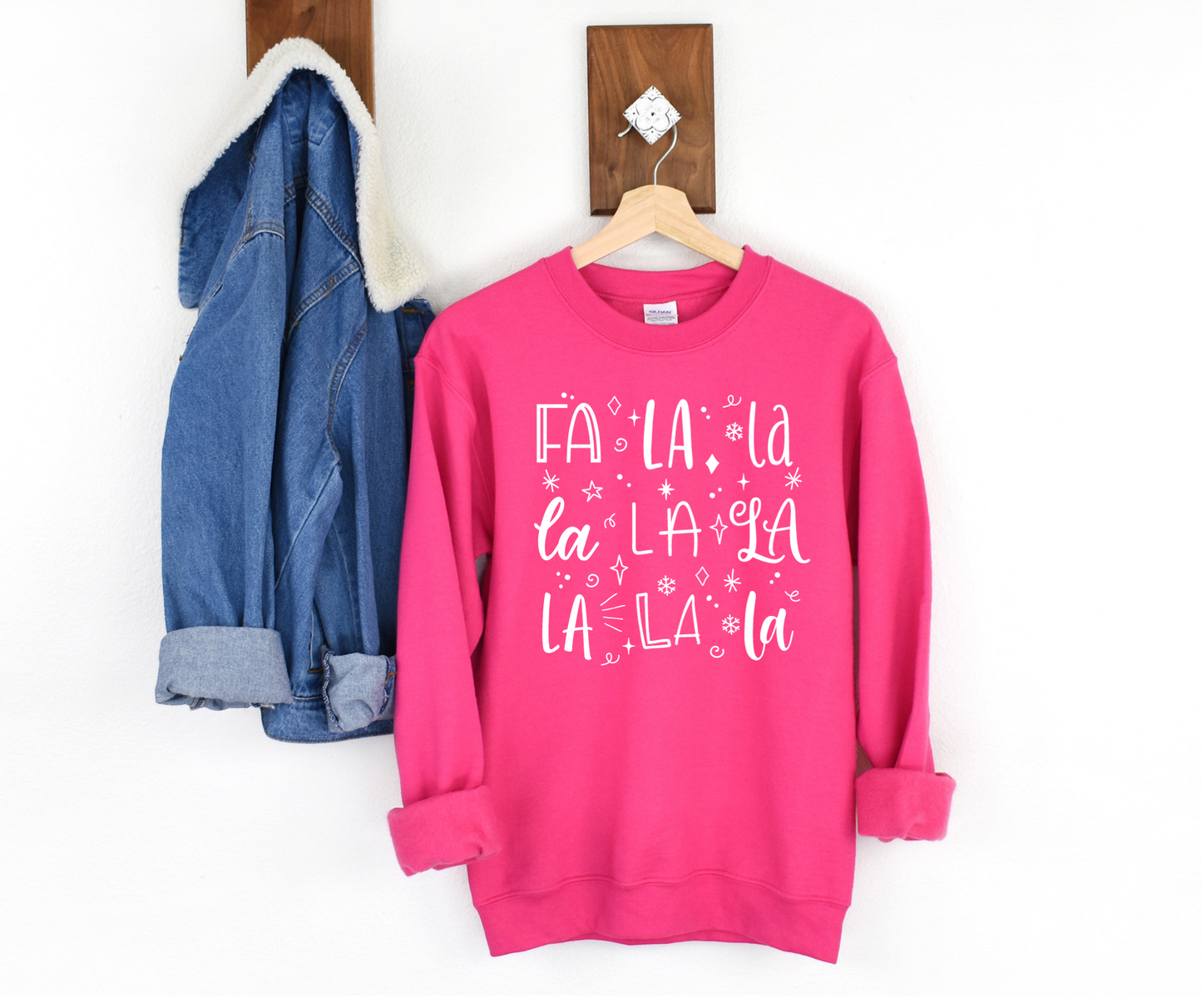 Bright pink "FaLaLa" graphic sweatshirt with white lettering. Unisex fit. Relaxed and comfy.