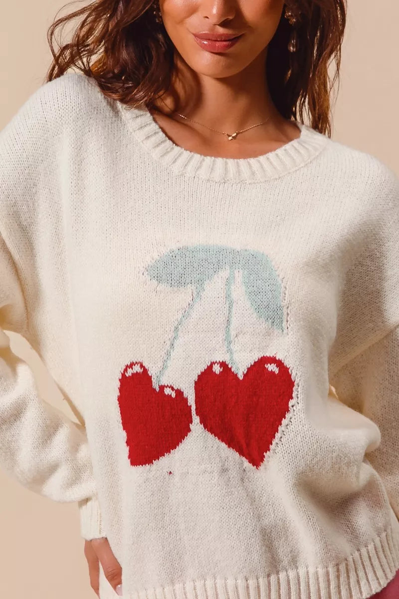 Close-up of Gina Heart Cherry Sweater showing heart and cherry design detail.