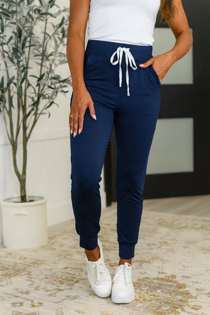 Giving the Run Around Joggers in Navy - Athletic Knit, Elastic Waist, Functional Pockets
