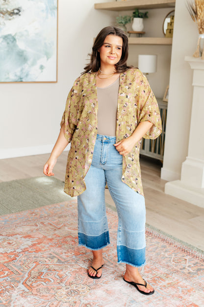 Plus size model in Ayla Kimono over casual outfit, boho floral embroidery.