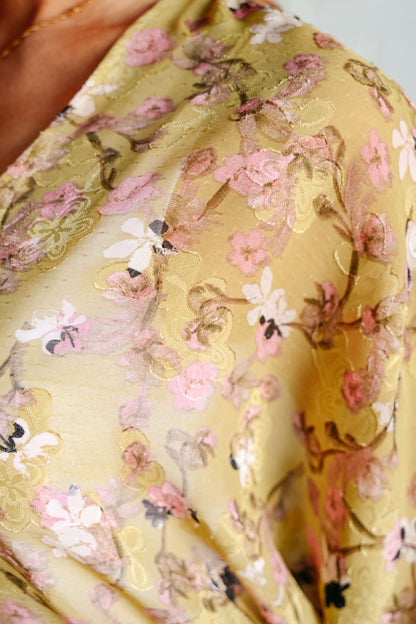 Close-up view of the Ayla Floral Kimono fabric in Yellow Pear.