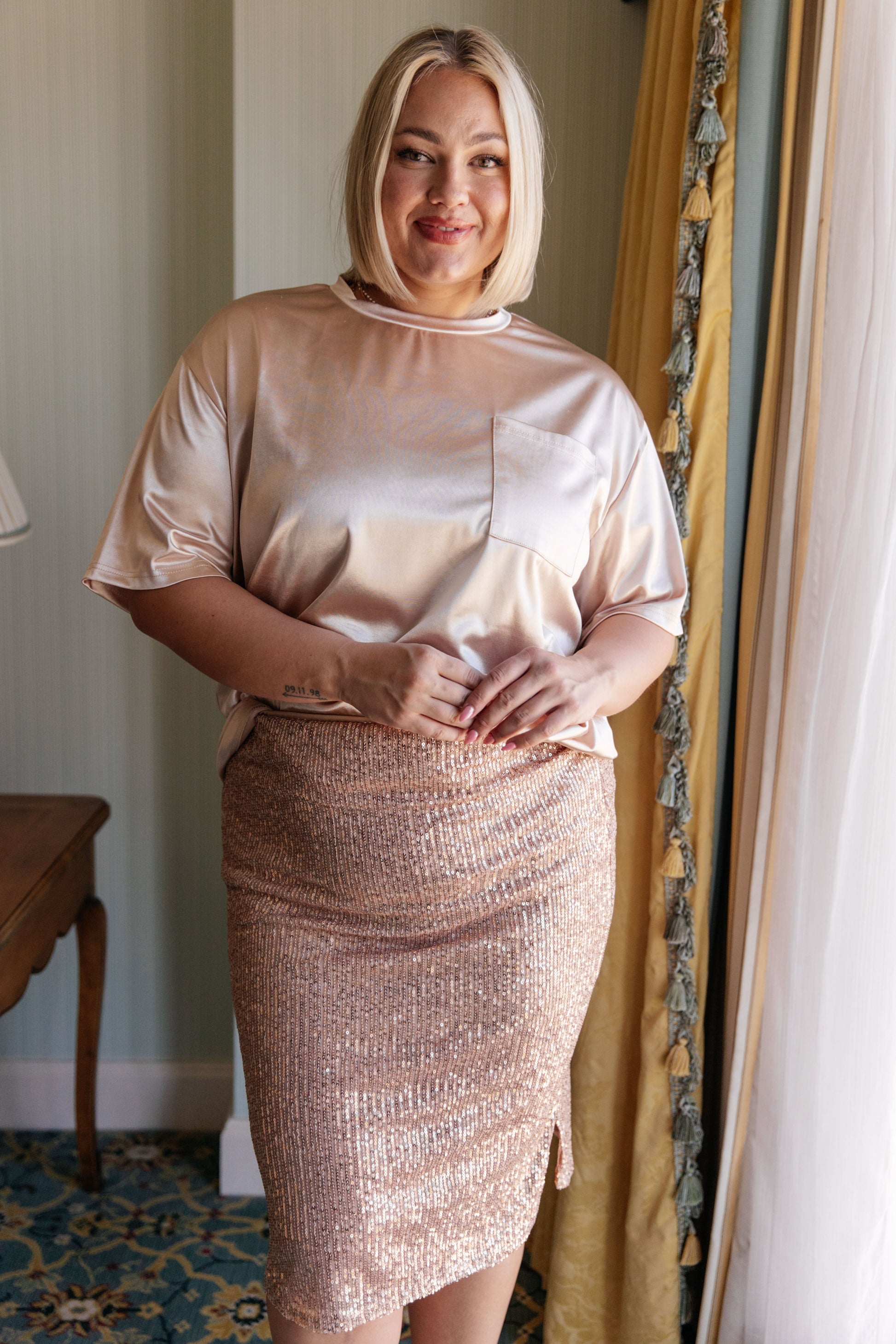 Gilded Age Sequin Skirt in champagne, featuring a sequin mesh fabric, tulip hem, cased elastic waistband, and fully lined for a flattering fit.