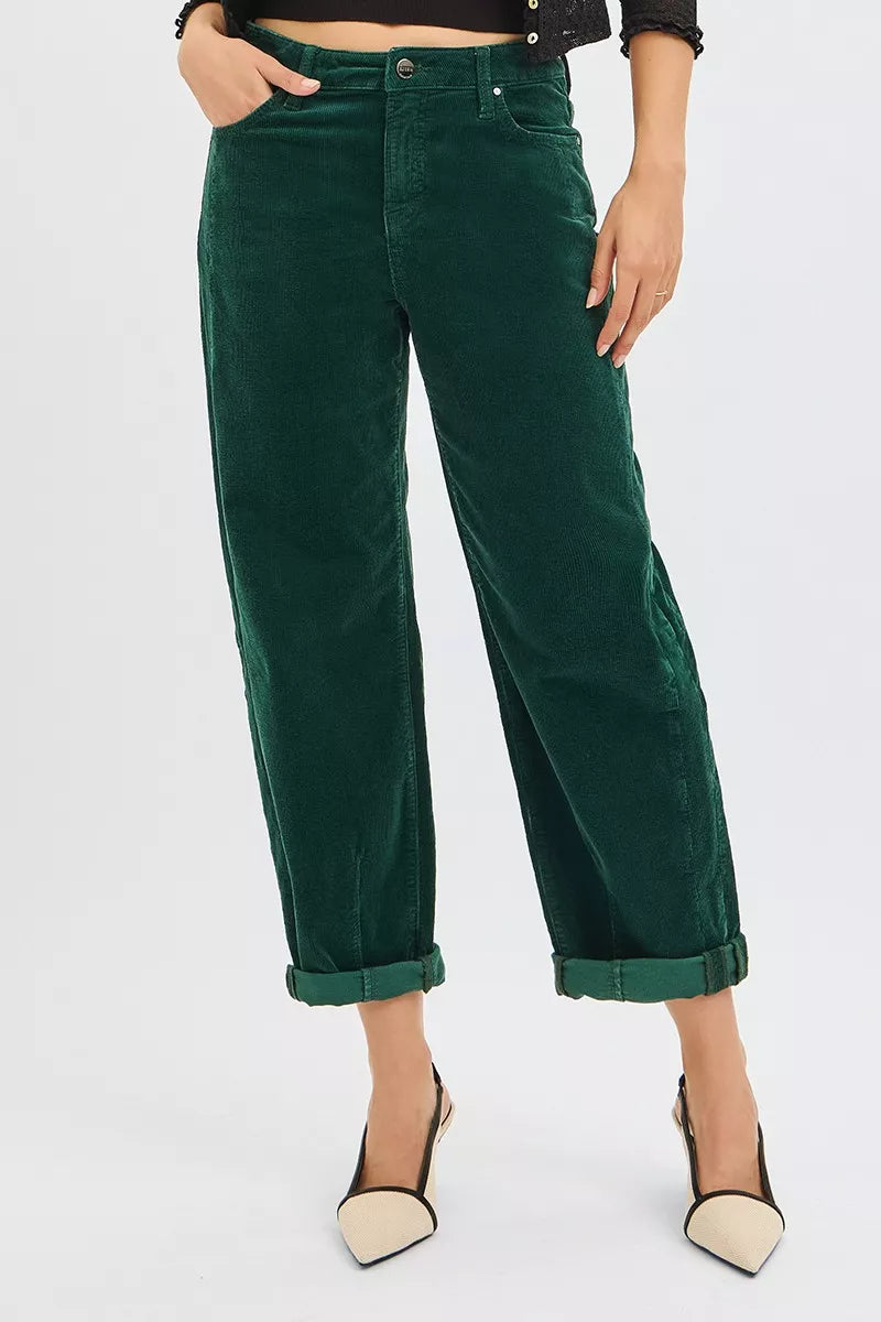 Front view in Greer High Rise Corduroy Pants, flattering barrel cut in hunter green corduroy.