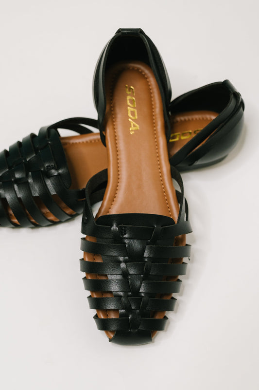Front view of Gulla Woven Slip On Flats showing woven texture and rounded toe.