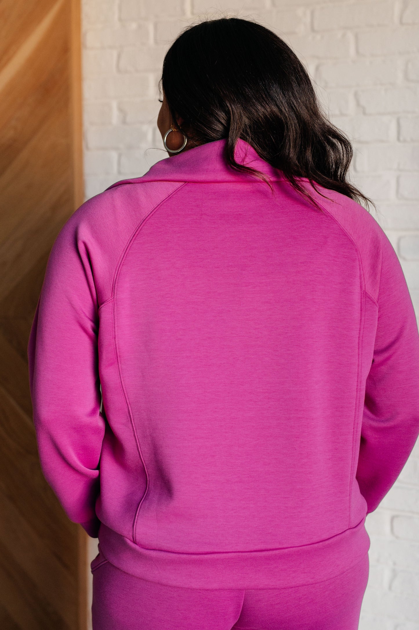 Women's Hampton Half Zip Pullover in Magenta with soft scuba modal fabric, a mock neck, banded cuffs and hem, raglan sleeves, and a half-zip closure.