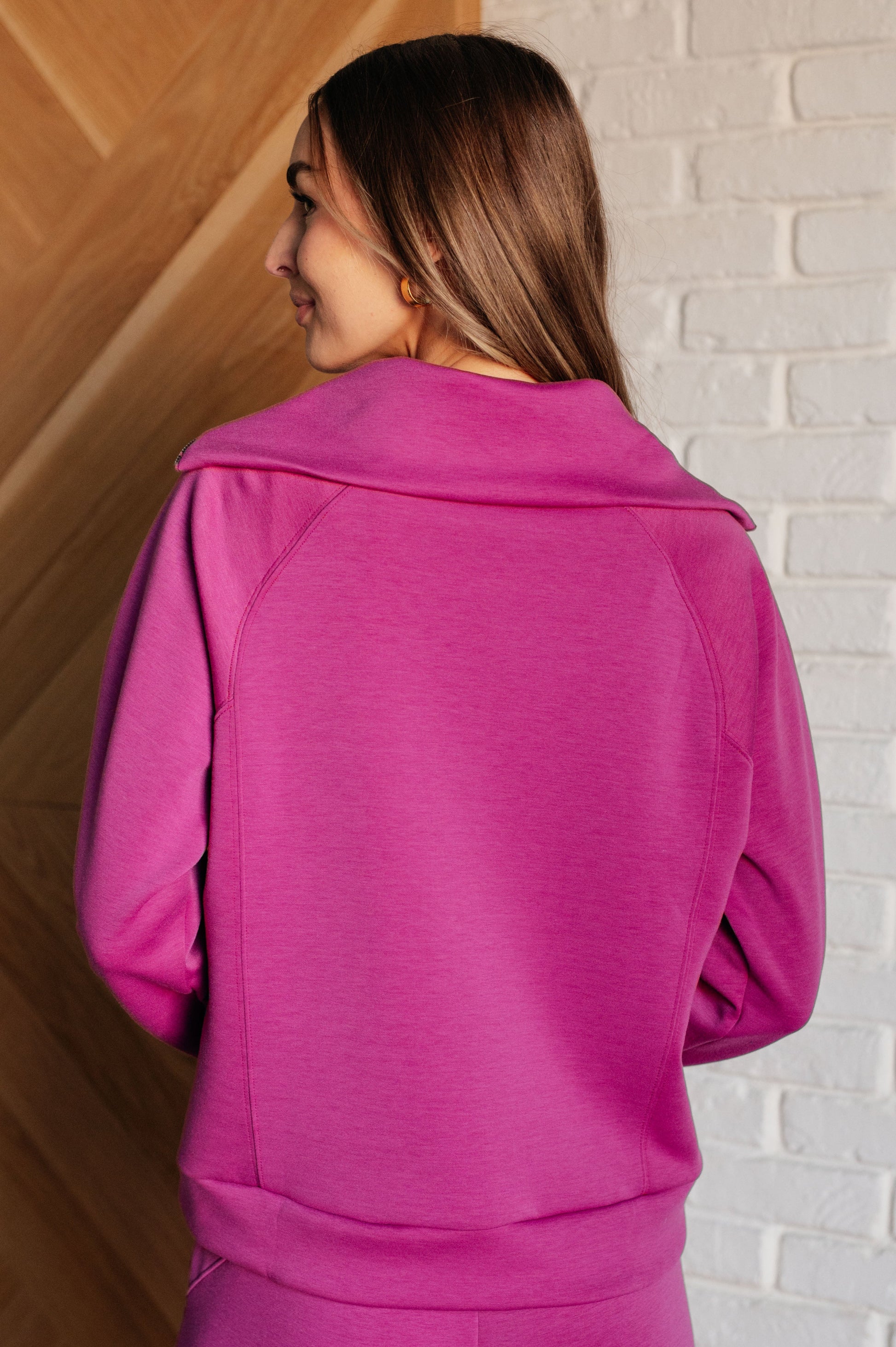 Women's Hampton Half Zip Pullover in Magenta with soft scuba modal fabric, a mock neck, banded cuffs and hem, raglan sleeves, and a half-zip closure.