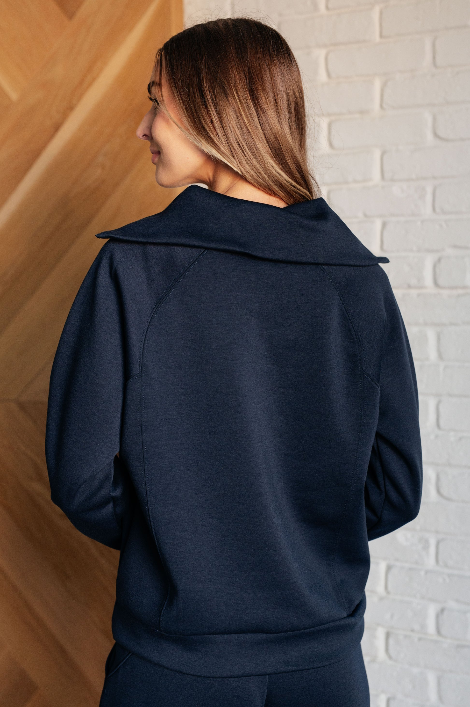 Women's Hampton Half Zip Pullover in Navy with soft scuba modal fabric, a mock neck, banded cuffs and hem, raglan sleeves, and a half-zip closure.