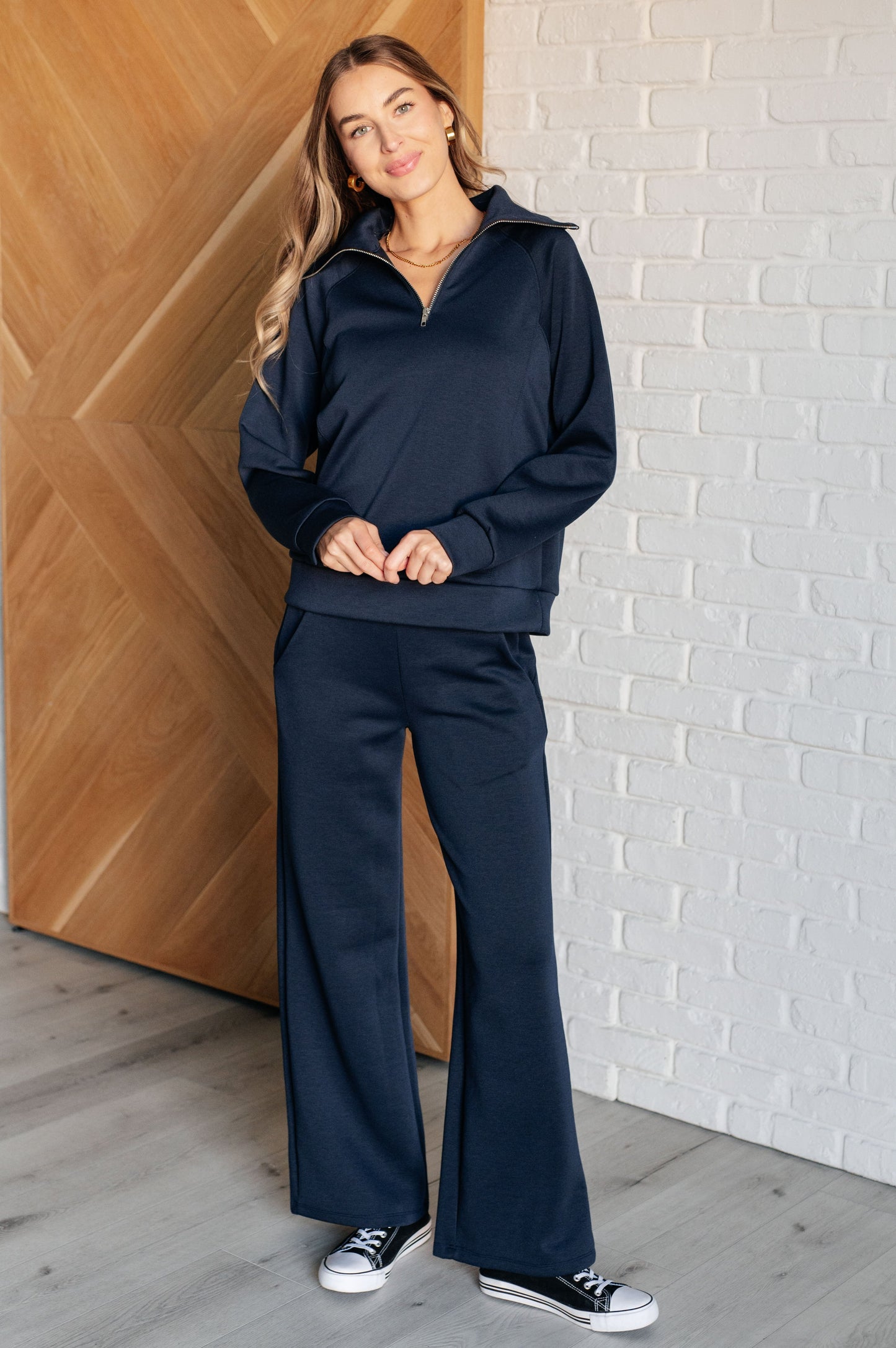 Women's Hampton Half Zip Pullover in Navy with soft scuba modal fabric, a mock neck, banded cuffs and hem, raglan sleeves, and a half-zip closure.