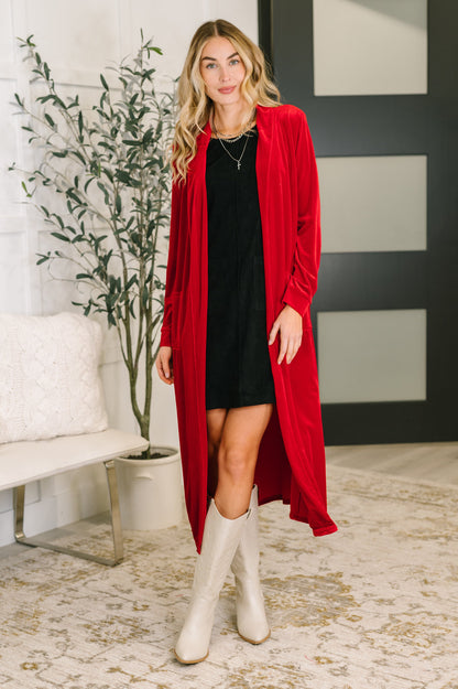 Model adjusting Flannery Corduroy Dress to show cozy corduroy fabric.