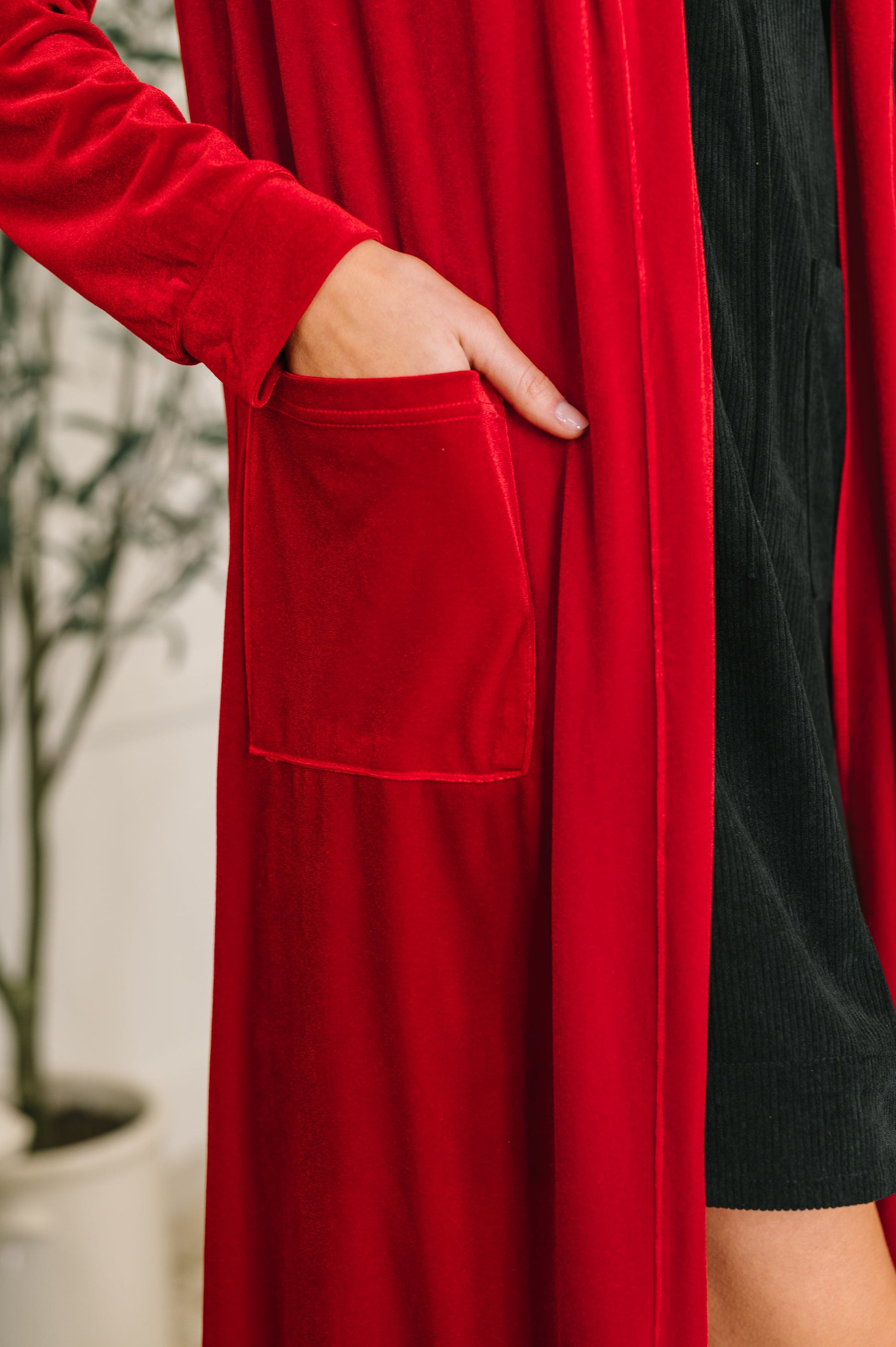 Pocket detail shot of Harley Long Velvet Cardigan showing front patch pockets.