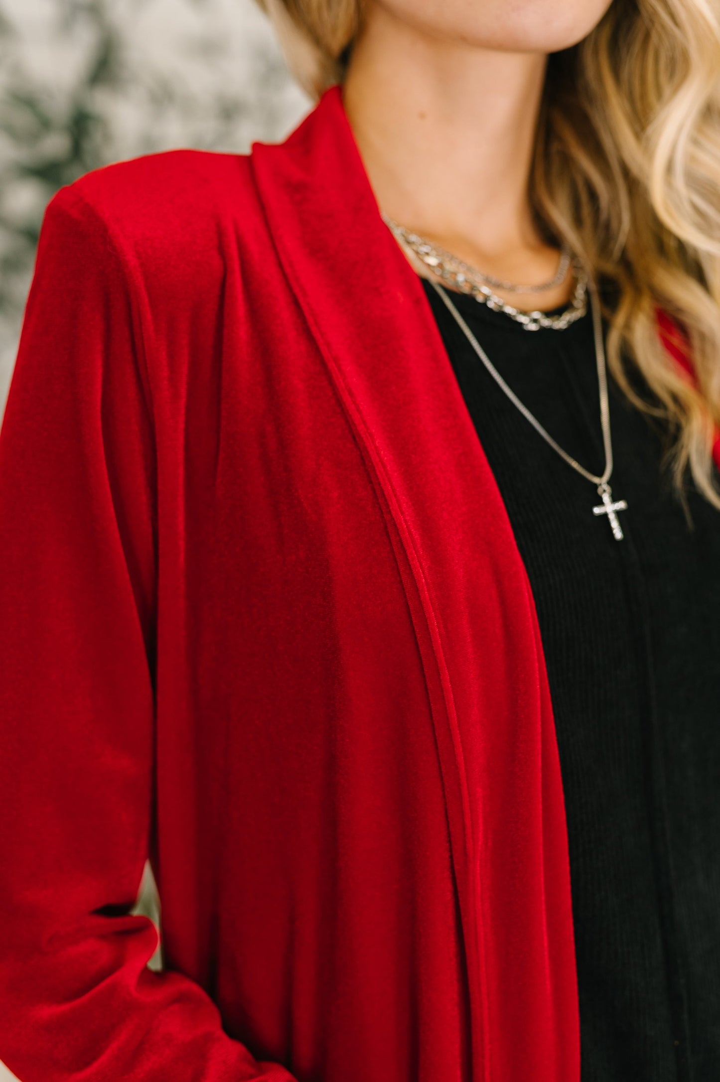 Close-up of Harley Long Velvet Cardigan showing rich red velvet knit texture.