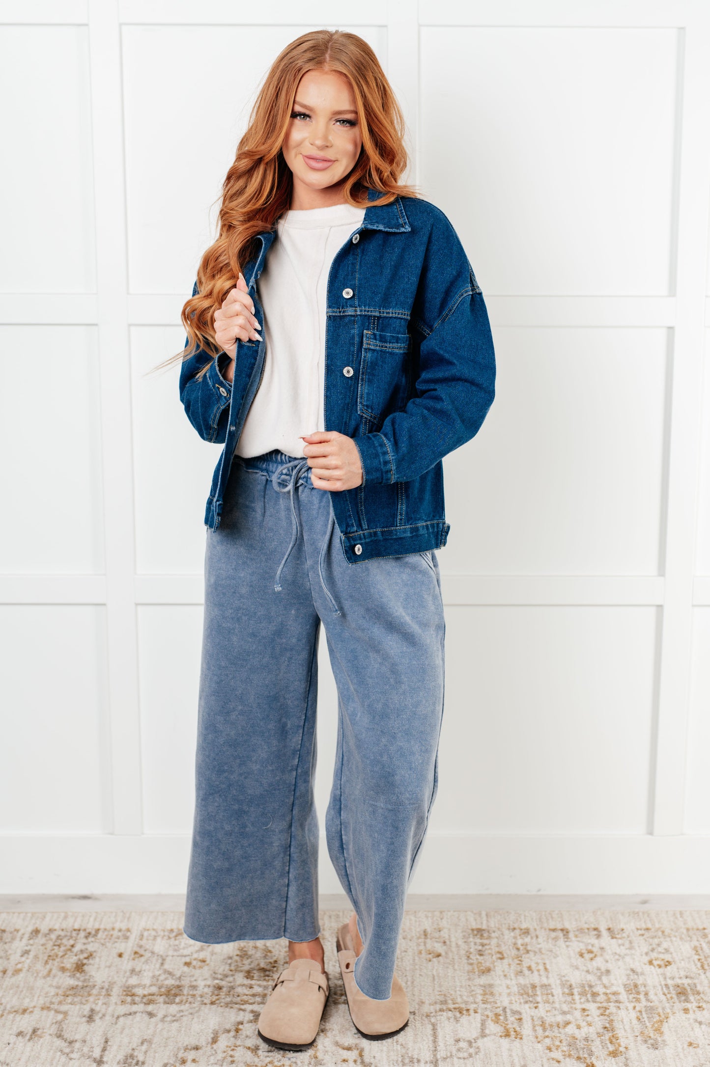 Havina Oversized Denim Jacket with collared neckline, front button closures, chest patch pockets, sleeve cuff buttons, and back pleat detail.