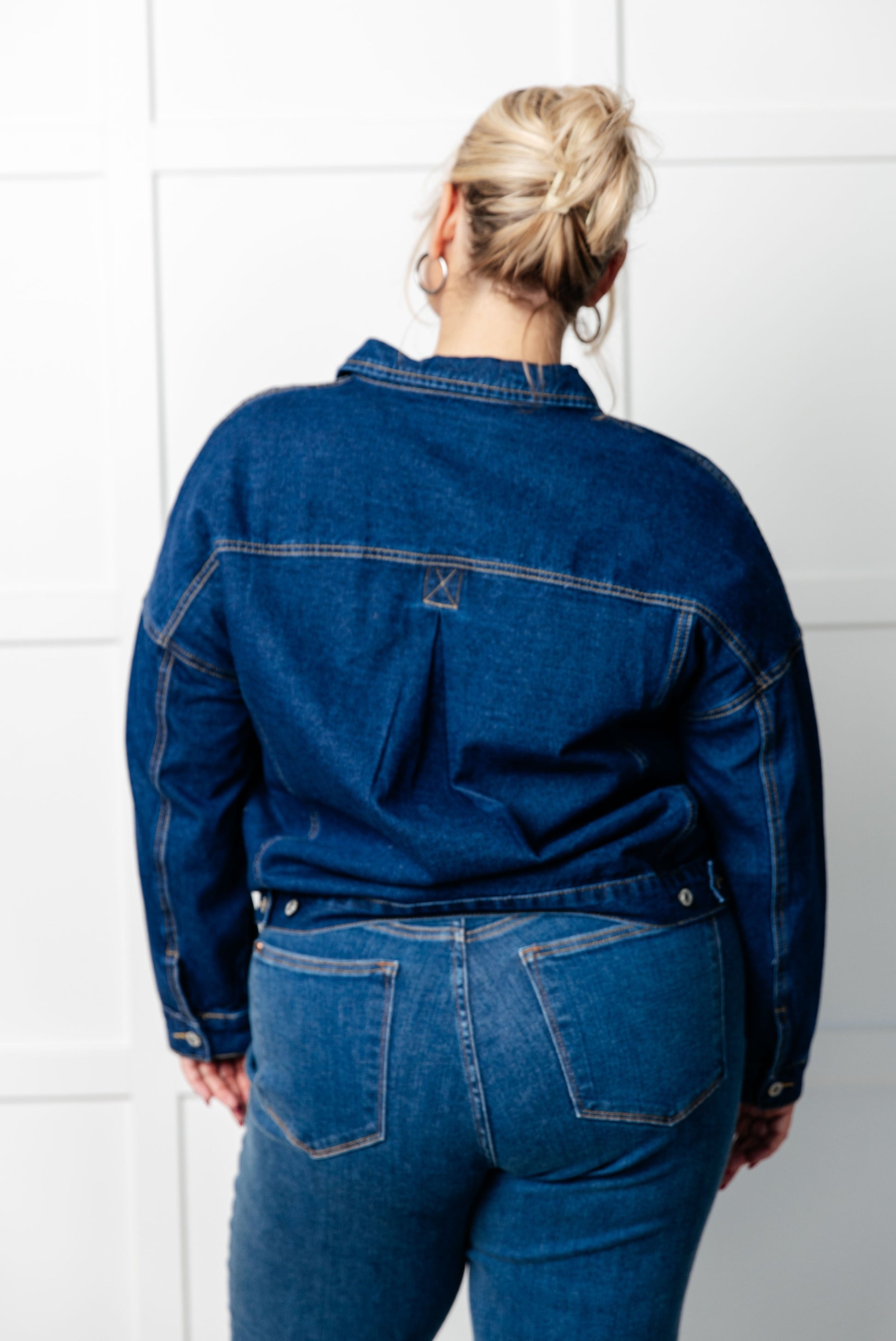 Havina Oversized Denim Jacket with collared neckline, front button closures, chest patch pockets, sleeve cuff buttons, and back pleat detail.