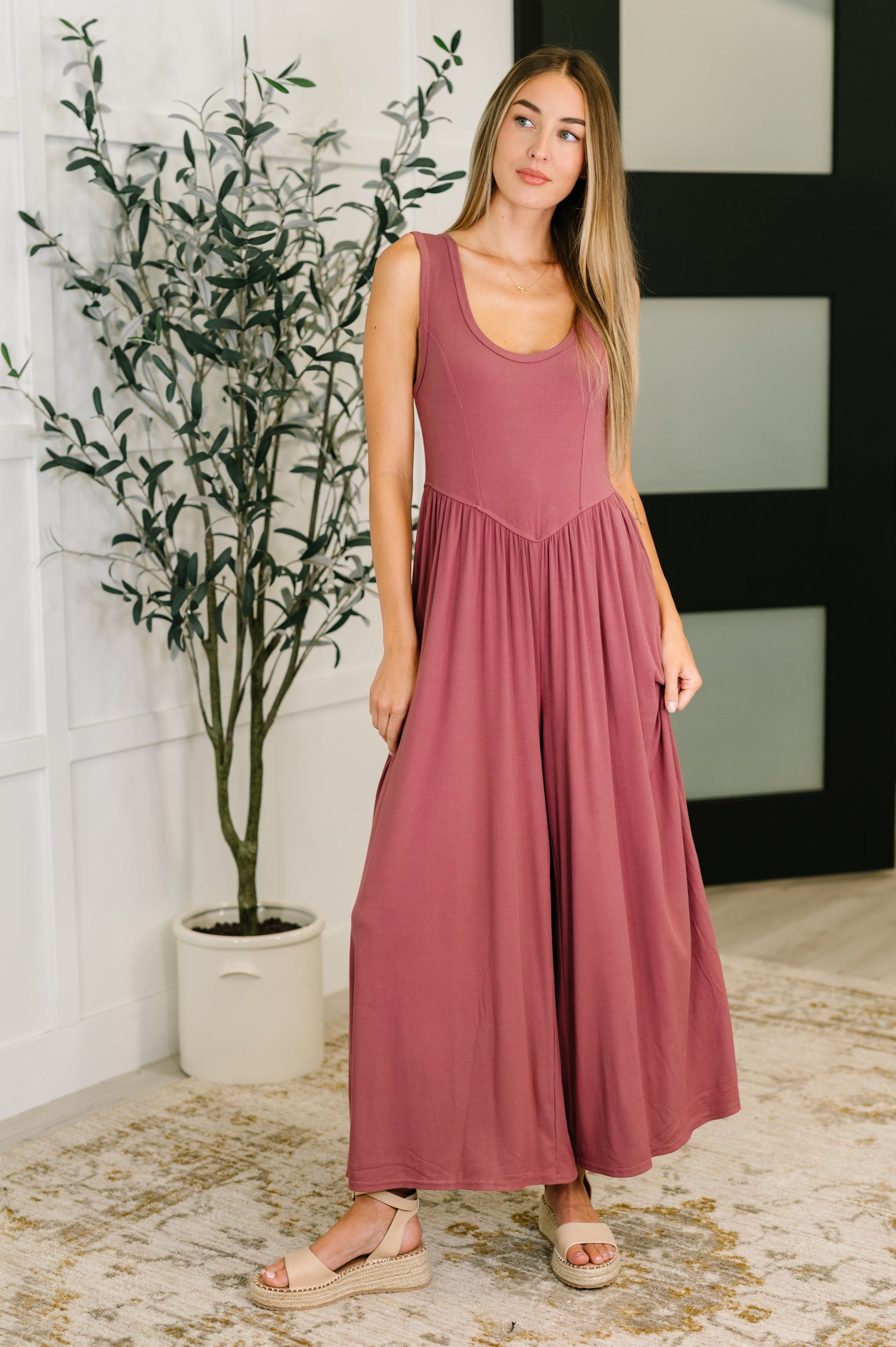 Front view showcasing flattering fit of Pyper Mauve Ribbed Knit Jumpsuit with wide leg cut