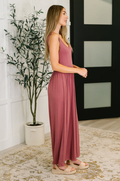 Side view of Pyper Jumpsuit in mauve ribbed knit with elastic waistband and relaxed wide leg