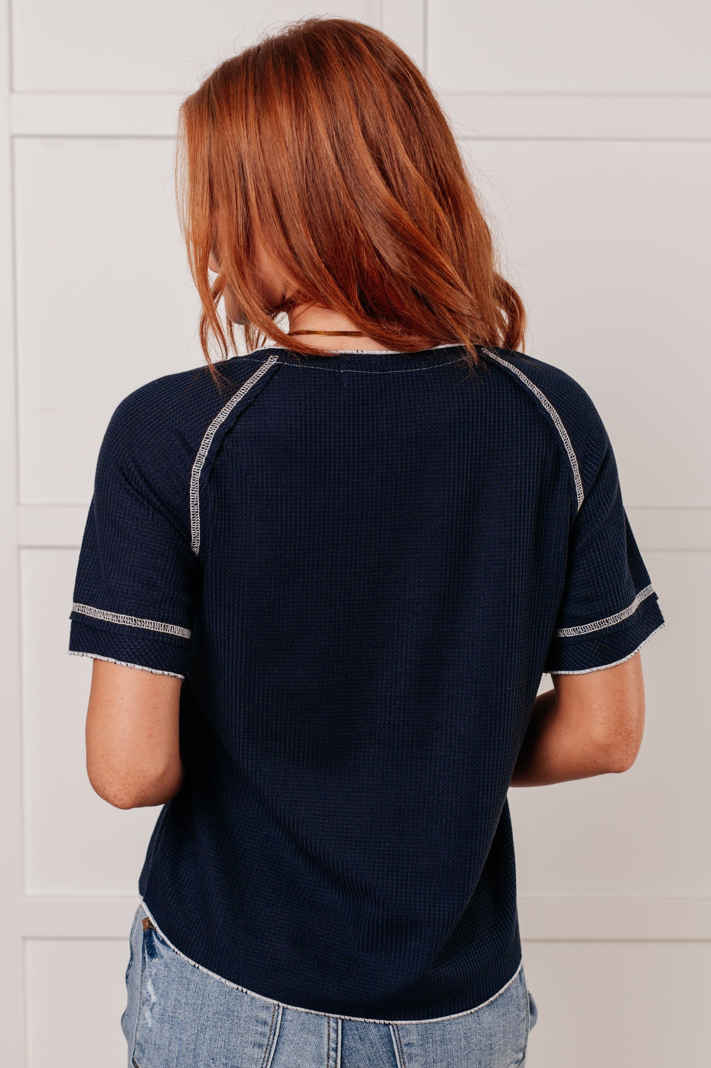 Waffle Knit Tee in Blue with round neckline, short raglan sleeves, and raw edge accents.