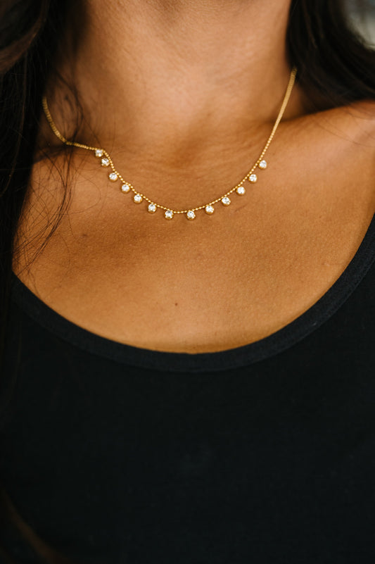 Here to Charm Necklace with gold-plated stainless steel bead chain and zircon stones.