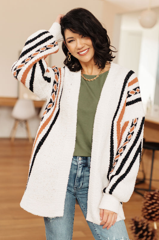Model wearing Hollis Aztec Print Cardigan in white with open front and dropped shoulders.