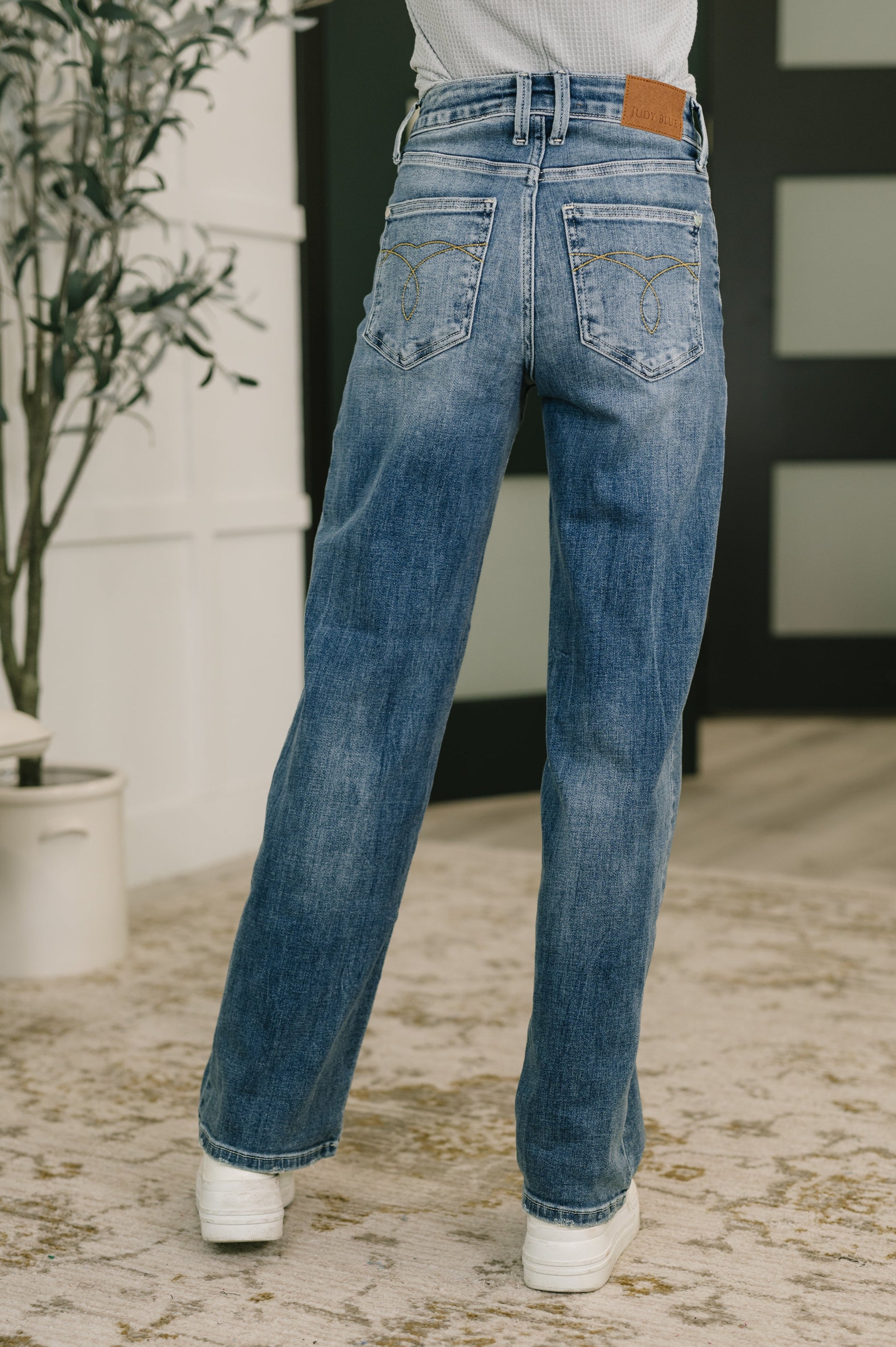 Back view of Holly Mid Rise Straight Jeans by Judy Blue embroidered pocket detail.