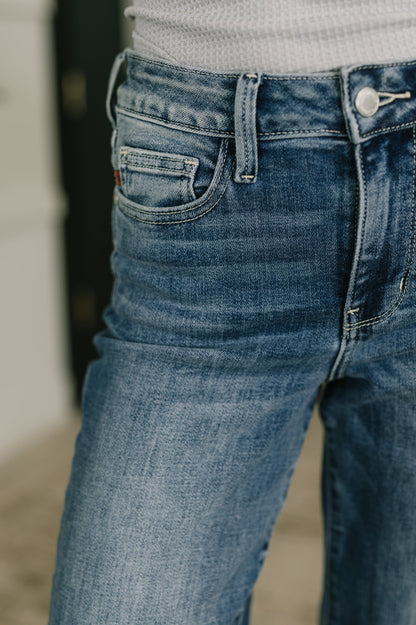 Close up of Holly Mid Rise Straight Jeans by Judy Blue light wash denim texture.