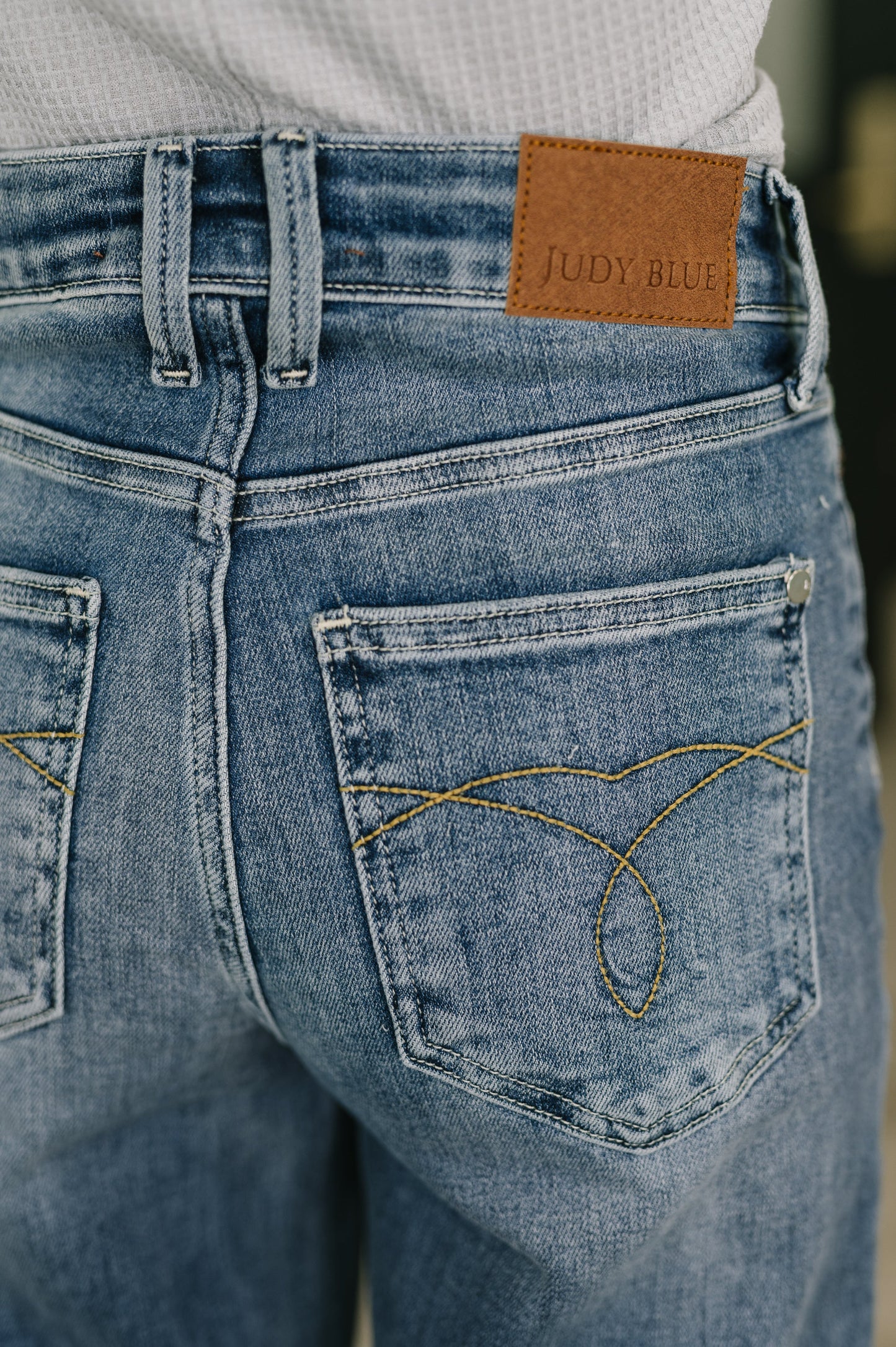Detail shot of Holly Mid Rise Straight Jeans by Judy Blue double belt loop.