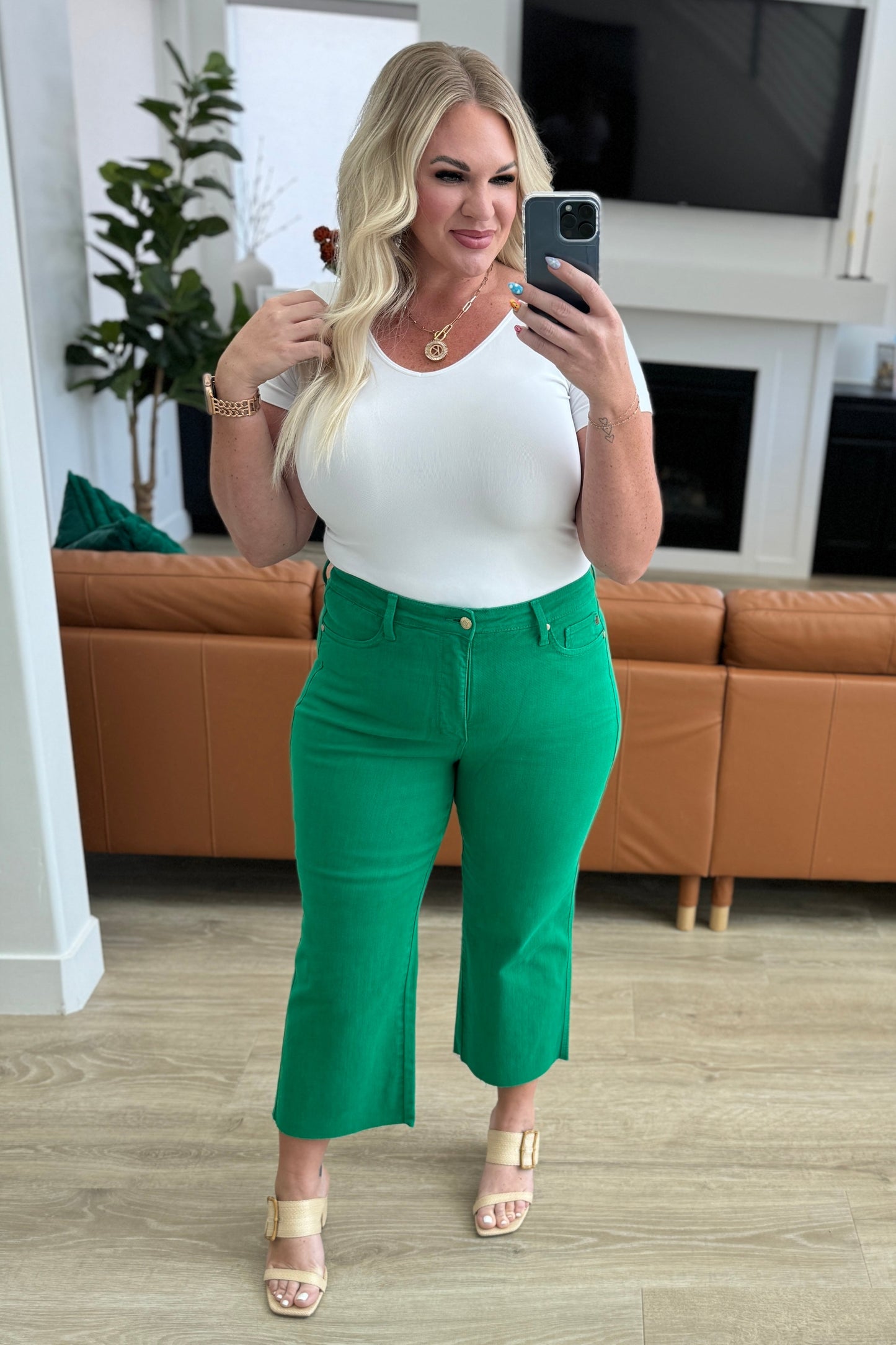 Kelly green high-rise wide leg crop jeans with raw hem and control top, featuring 4-way stretch for a comfortable, flattering fit.