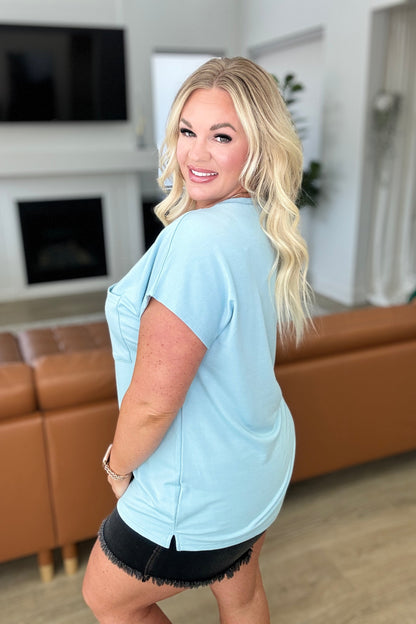 Side view plus size Briar Pocket Tee in Blue, relaxed fit with dolman sleeves and casual drape.