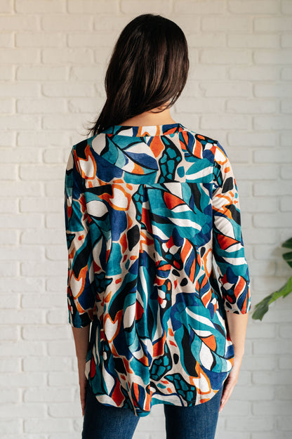 Back view of Imani Abstract Teal Top highlighting abstract print.