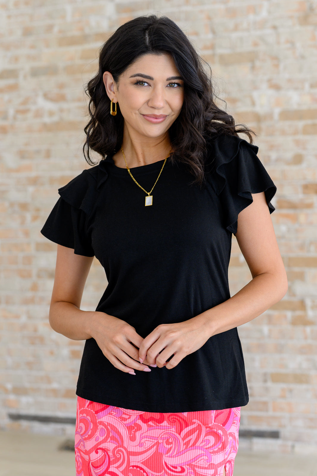 Solana Flutter Sleeve Tee in black ribbed jersey knit front view with layered flutter sleeves.