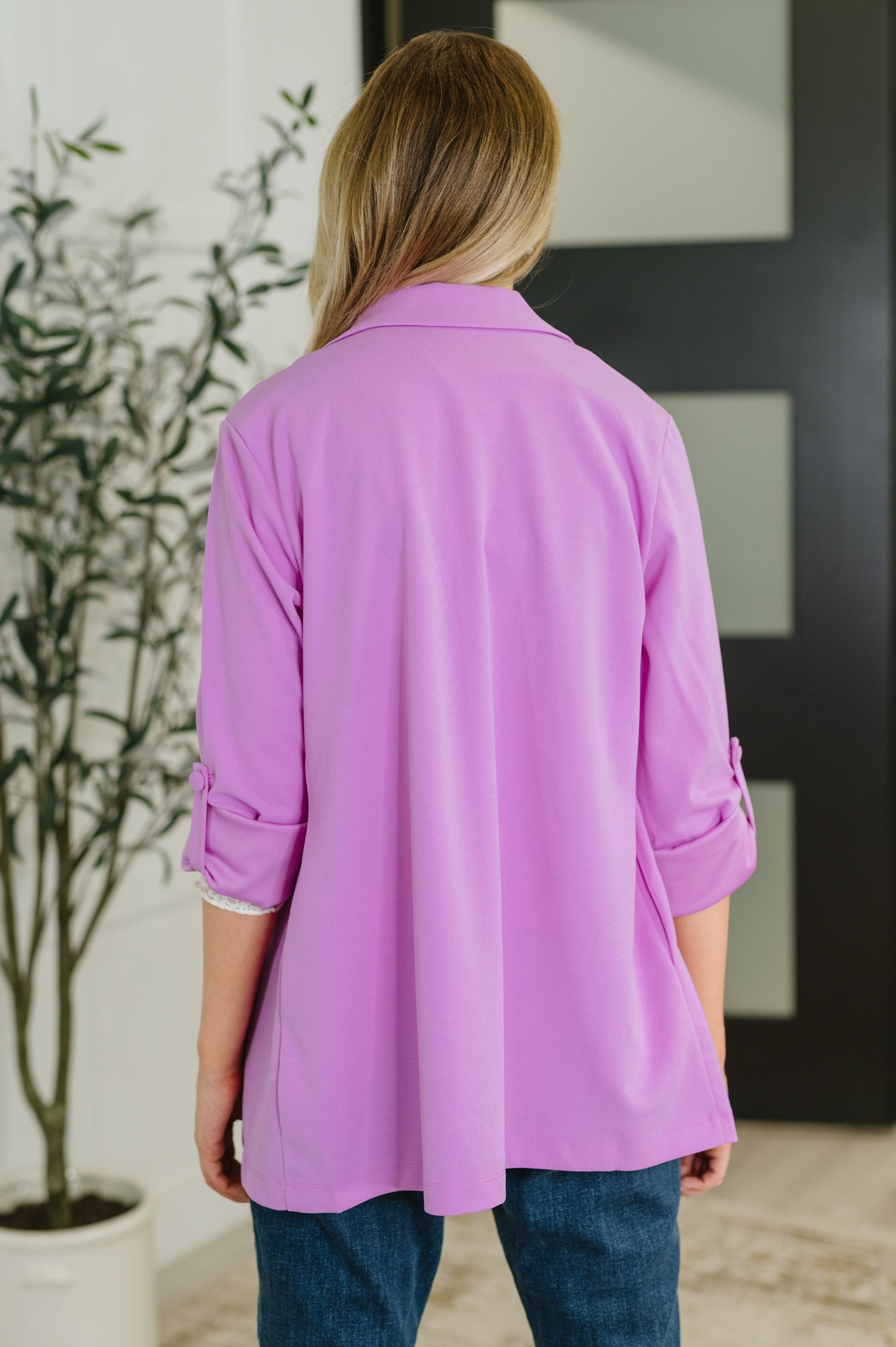 Back view of Remi Orchid Glow Blazer highlighting sleek polyester crepe fabric and smooth tailored seams.