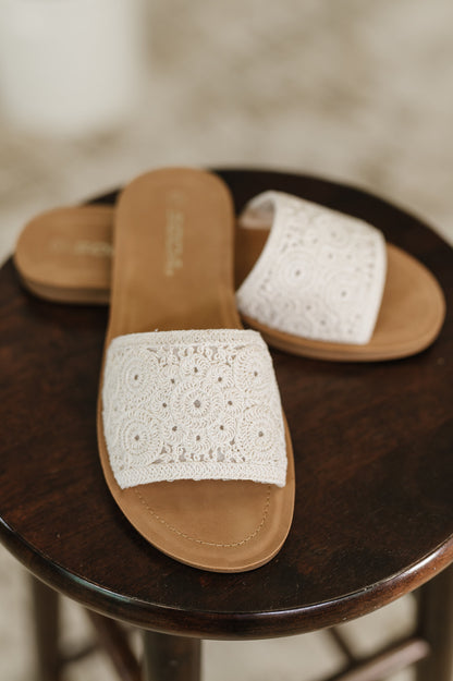 Imelda off white crocheted slip-on sandals with macrame strap, round toe, and rubber sole – summer footwear.