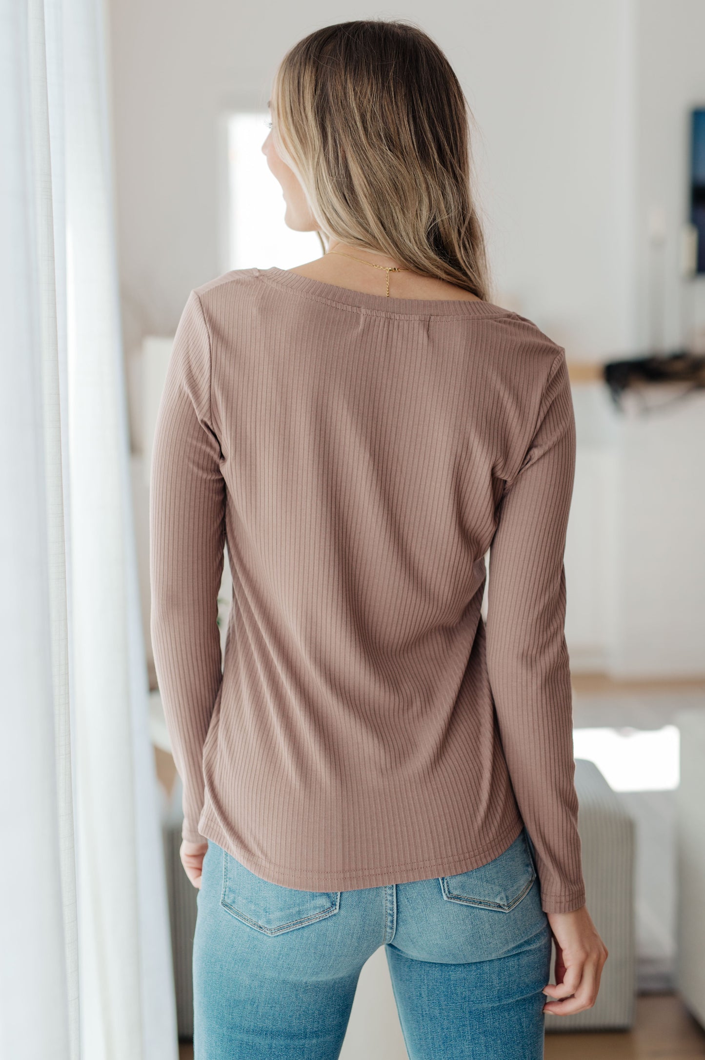 Back view of Indie Long Sleeve V-Neck Top in Beige with smooth ribbed knit fabric.