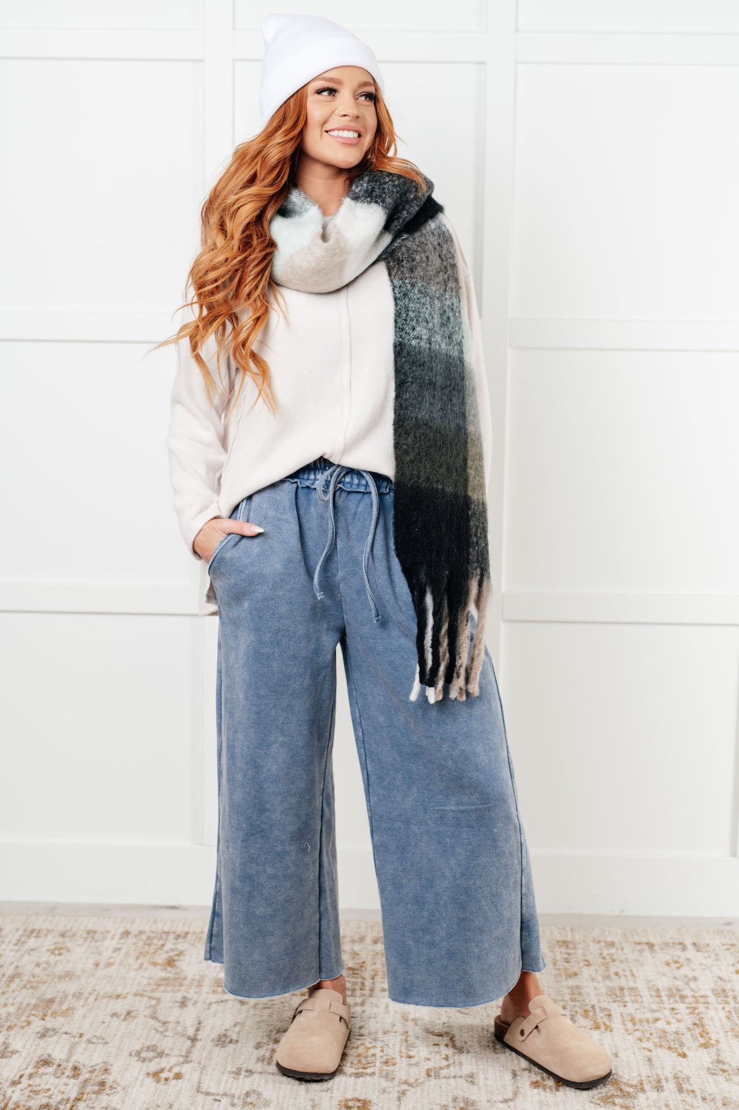 Women's oversized plaid fringe scarf in gray and jade.