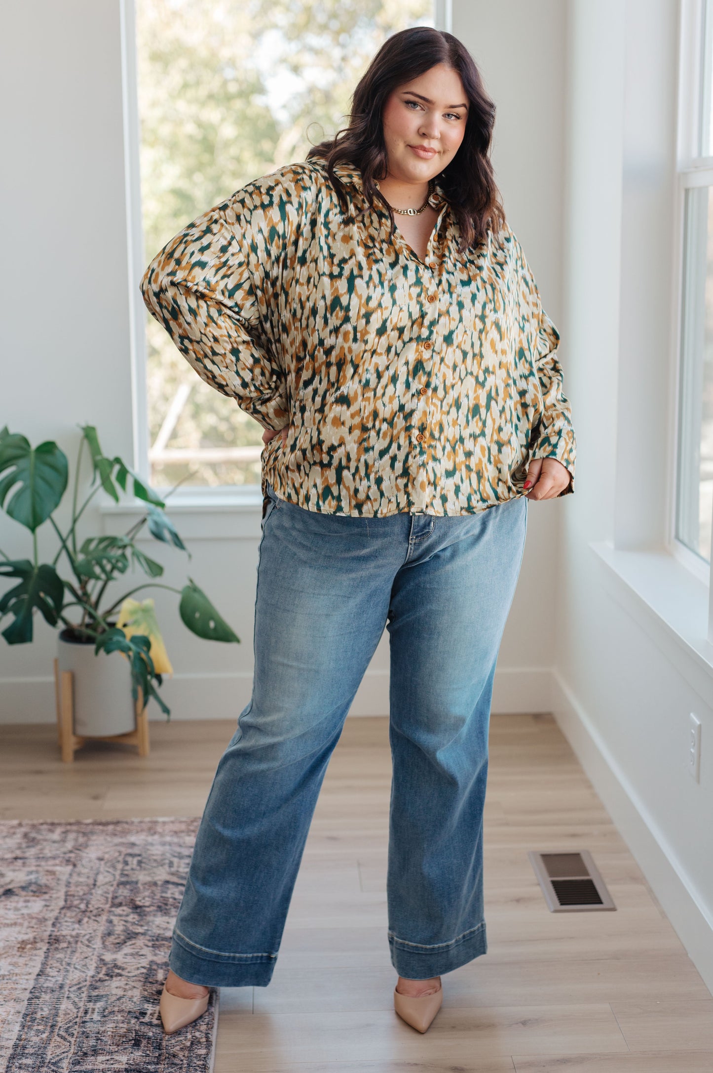 Mustard and tan abstract print blouse made from poly satin, featuring a collared neckline, button front fastening, and buttoned sleeve cuffs.