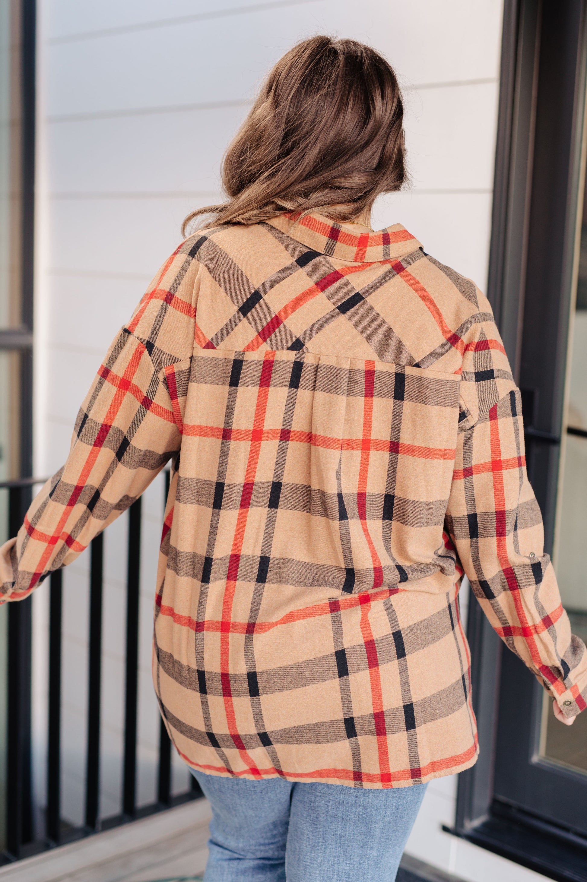 Women's lightweight flannel plaid shirt with a collared neckline, long sleeves with dropped shoulders, optional roll-tab sleeves, and side slits.