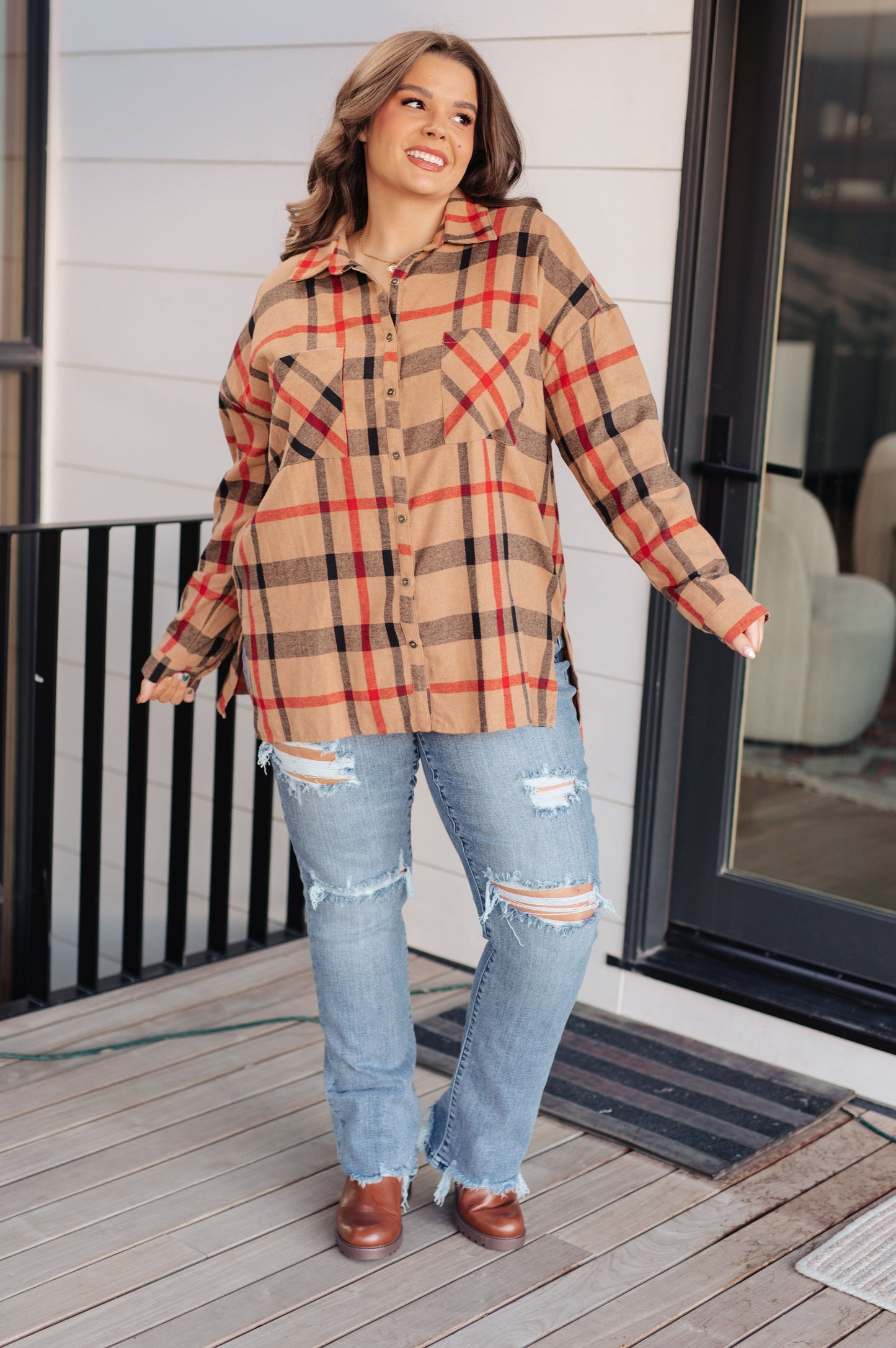 Women's lightweight flannel plaid shirt with a collared neckline, long sleeves with dropped shoulders, optional roll-tab sleeves, and side slits.