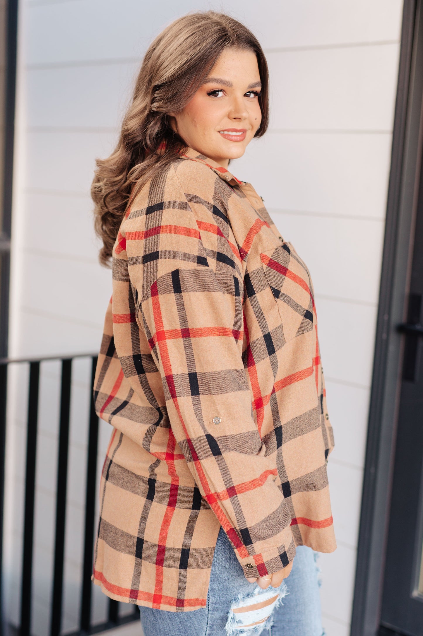 Women's lightweight flannel plaid shirt with a collared neckline, long sleeves with dropped shoulders, optional roll-tab sleeves, and side slits.