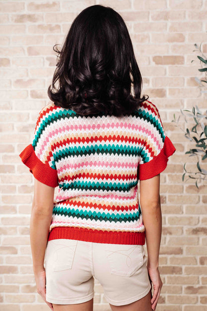 Back view of Novalee striped knit top showing colorful stripes and relaxed dolman sleeve fit