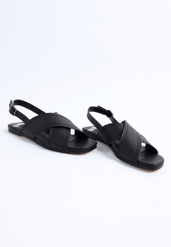 Side view of Jamon Classic Cross-Strap Buckled Flats in Black cross strap leather flats.