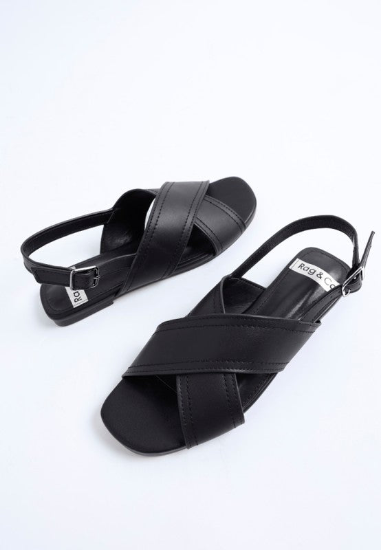 Side view of Jamon Classic Cross-Strap Buckled Flats in Black cross strap leather flats.