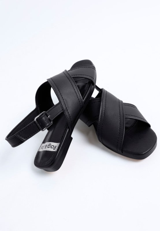Angled view of Jamon Classic Cross-Strap Buckled Flats in Black modern square toe.