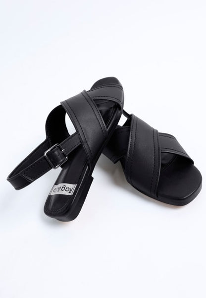 Angled view of Jamon Classic Cross-Strap Buckled Flats in Black modern square toe.