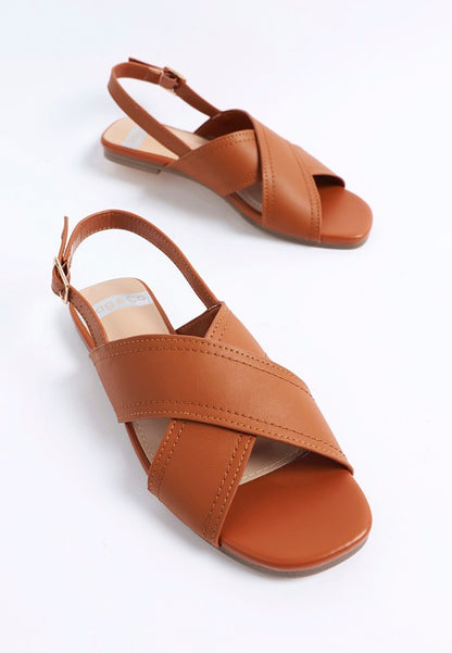 Front view of Jamon Classic Cross-Strap Buckled Flats in Tan open square toe flats.
