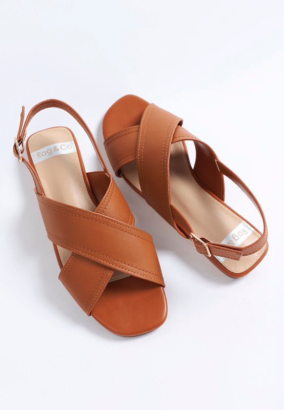 Flat lay of Jamon Classic Cross-Strap Buckled Flats in Tan casual leather flats.