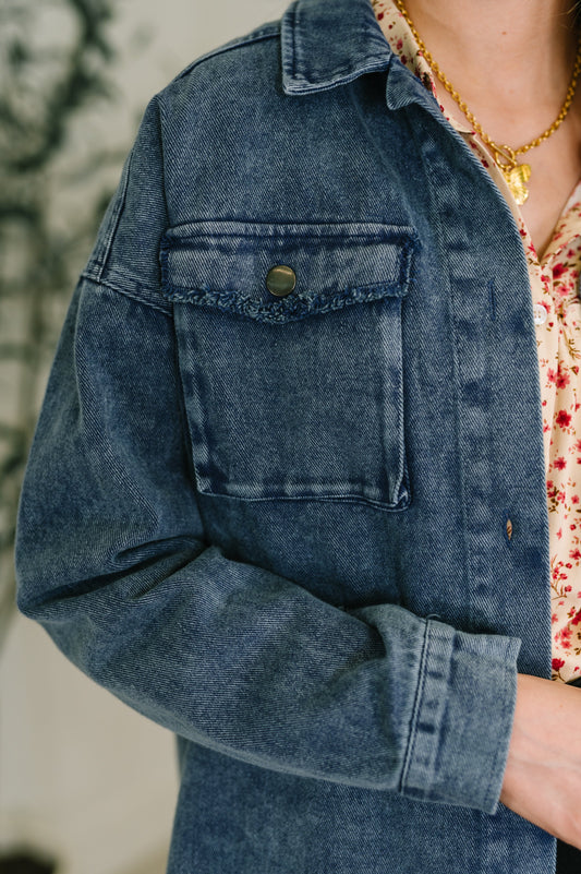 Front close-up of Fernanda Mineral Wash Shacket showing collared neckline, button closure, and gusseted pocket.