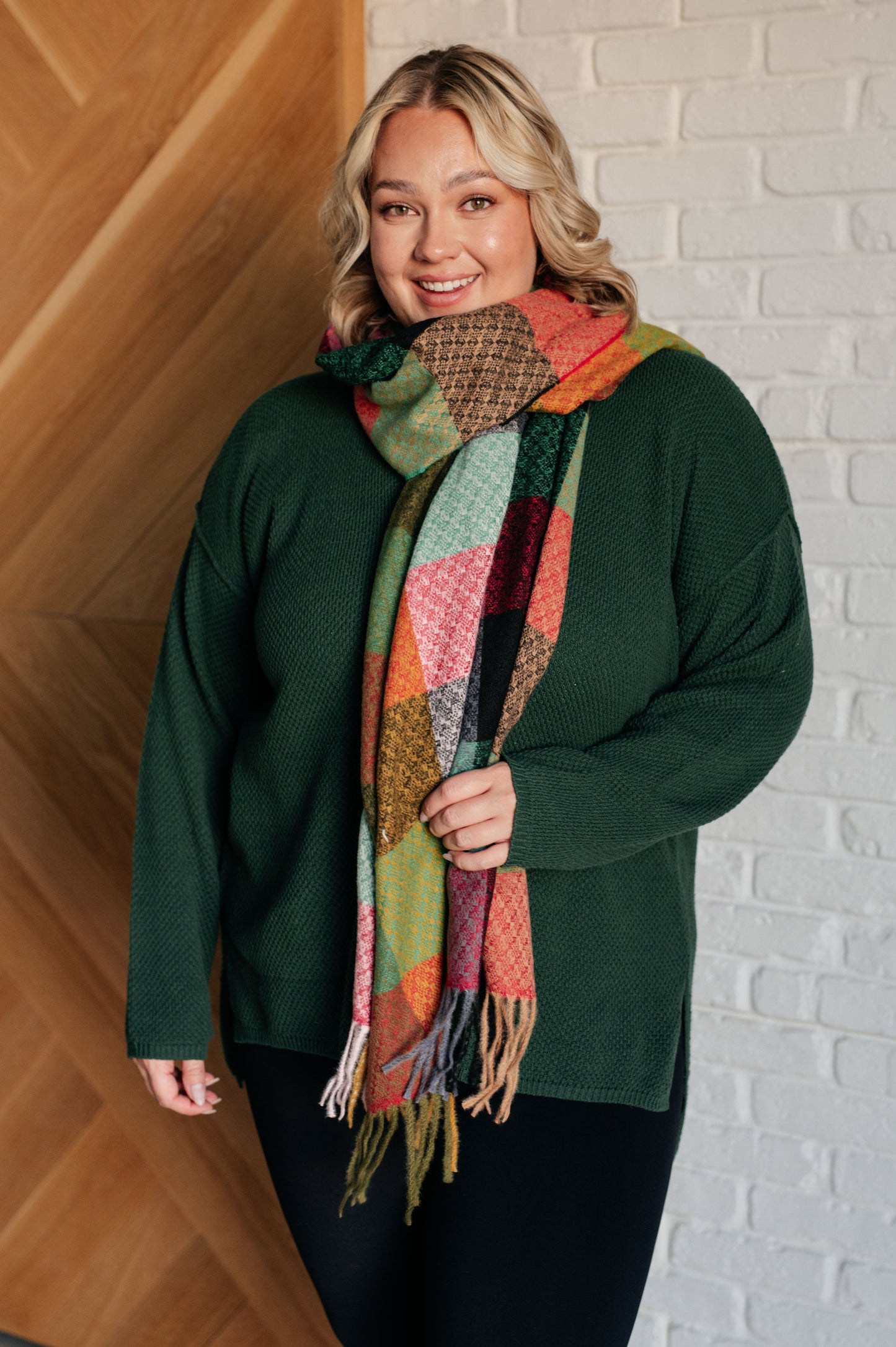 Women's cozy checkered fringe scarf in multicolor shades, made from warm brushed fabric with playful fringe. Versatile for layering as a scarf or shawl to elevate any outfit.