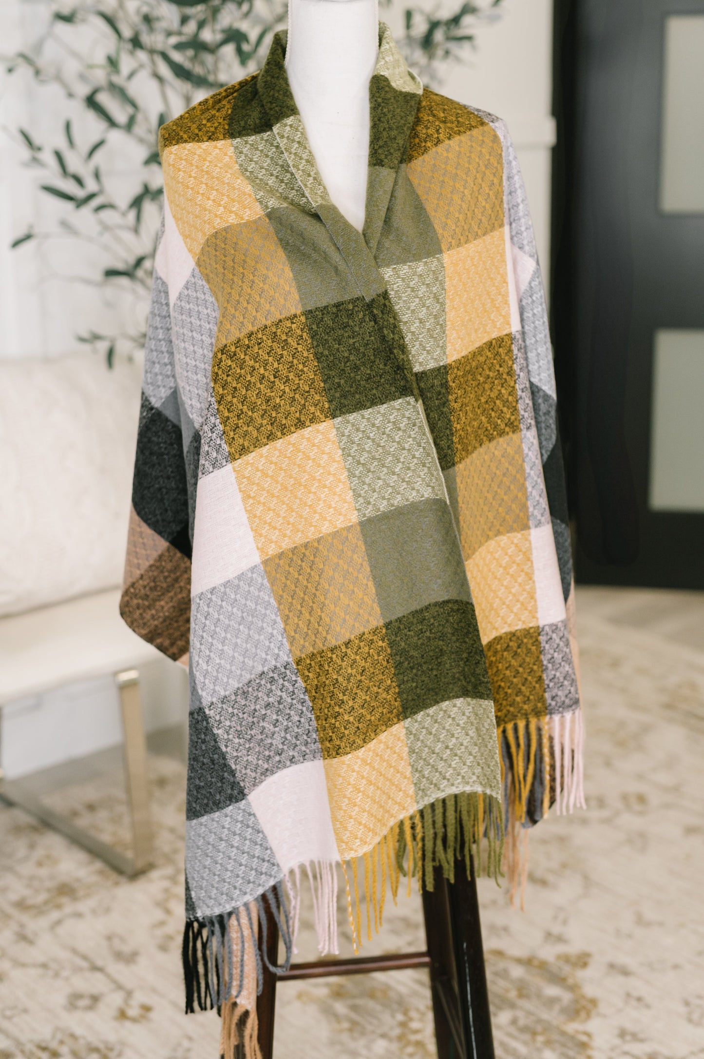 Flat lay of Keep Me Cozy Checkered Fringe Scarf showing checkered pattern.