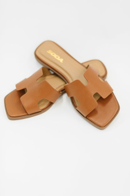 Flat lay of Knit Square Toe Slide On Sandal by Soda cognac PU leather slide sandal.