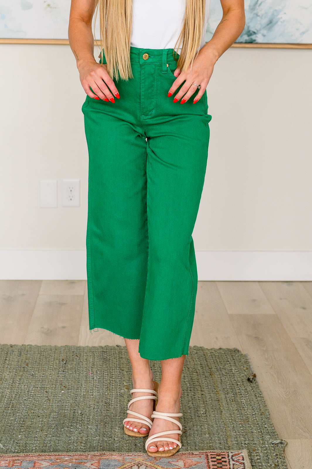 Kelly green high-rise wide leg crop jeans with raw hem and control top, featuring 4-way stretch for a comfortable, flattering fit.