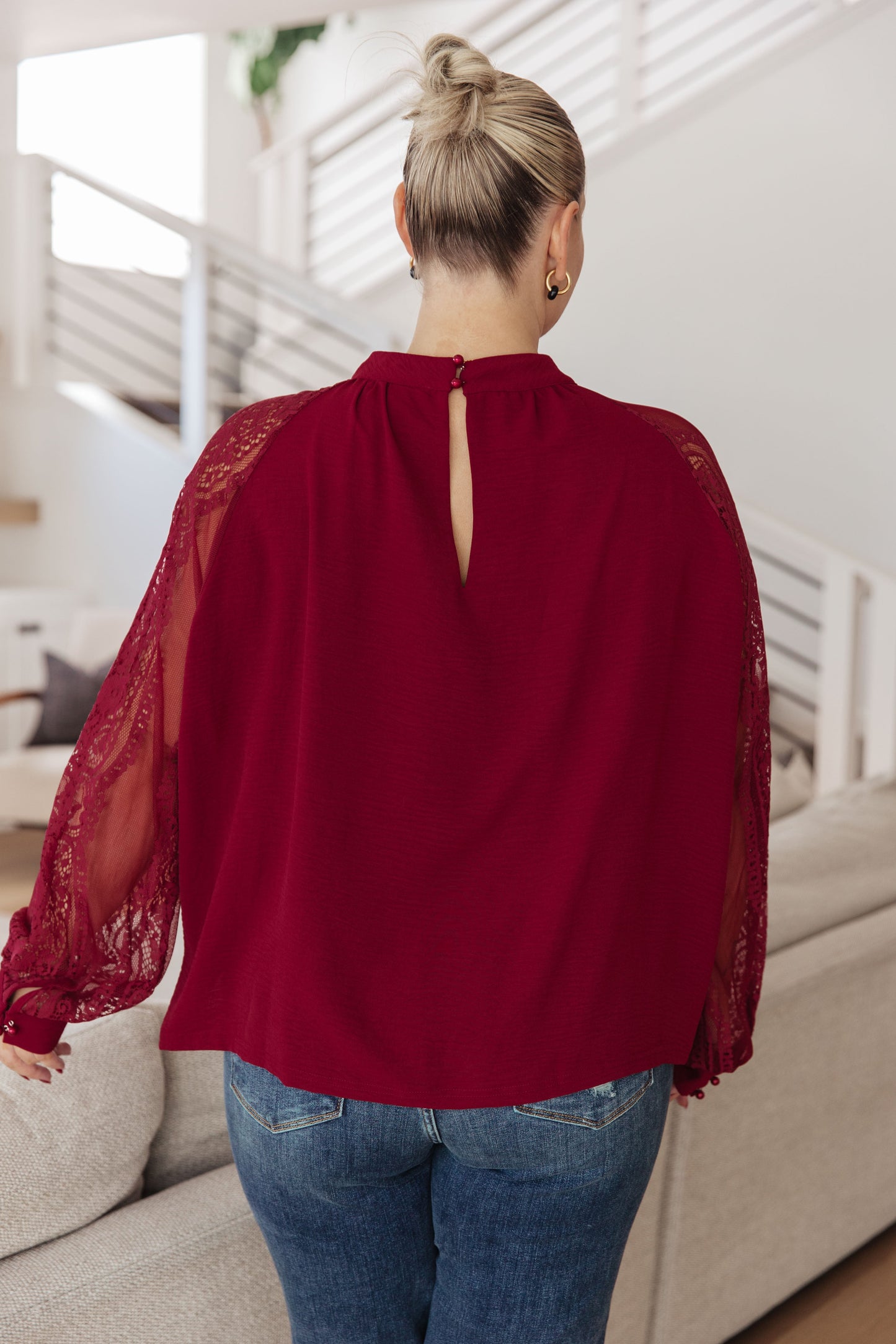 Back view of plus size Lacey Blouse with keyhole closure and long lace sleeves.